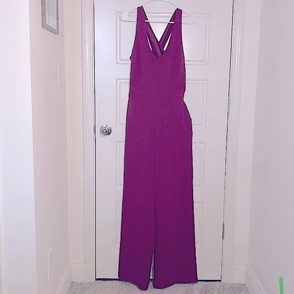 Crystal Sky v-neck criss-cross back purple jumpsuit with POCKETS. Size Large